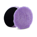 Two purple wool polishing pads with black backing, designed for use in polishing and cutting tasks, featuring soft, dense fibers for effective abrasion and finishing.