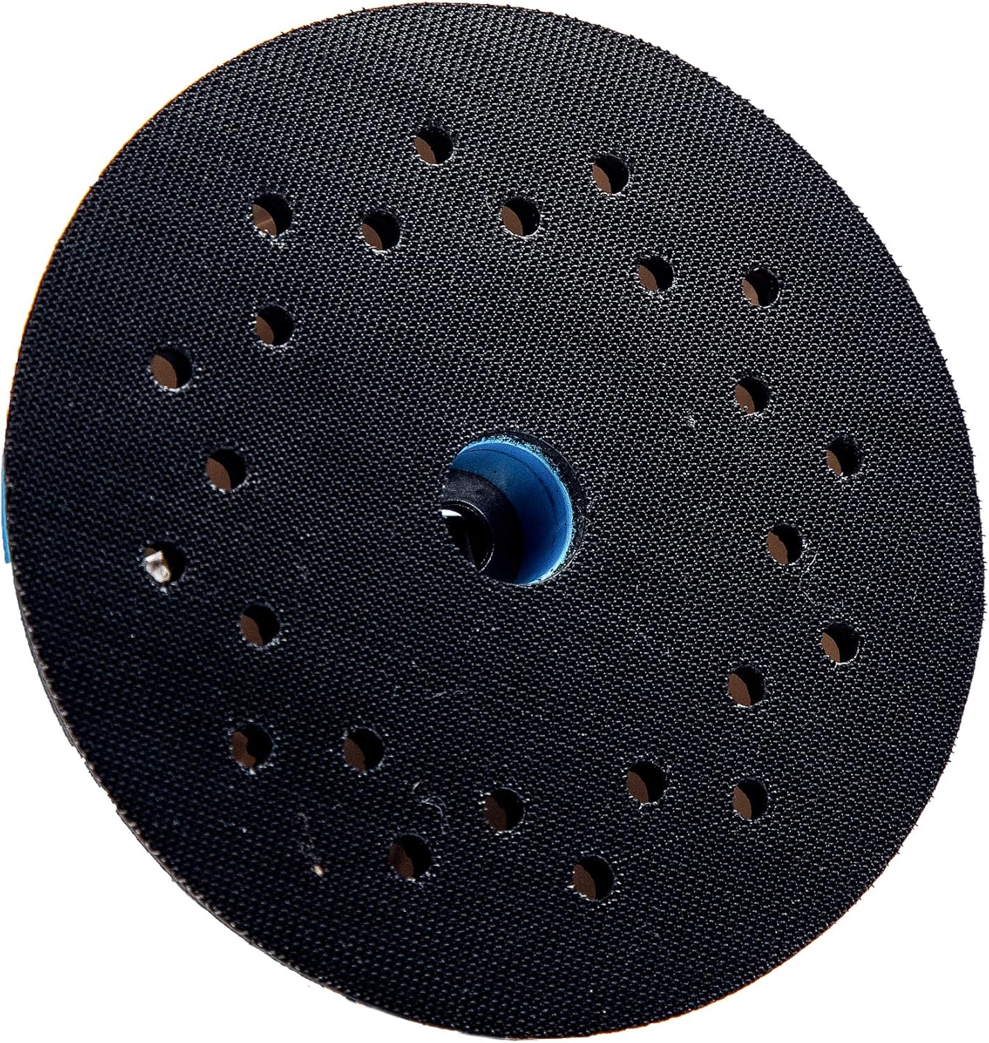 Close-up of a perforated polishing pad with multiple holes, designed for optimal airflow and dust extraction during polishing and sanding tasks.