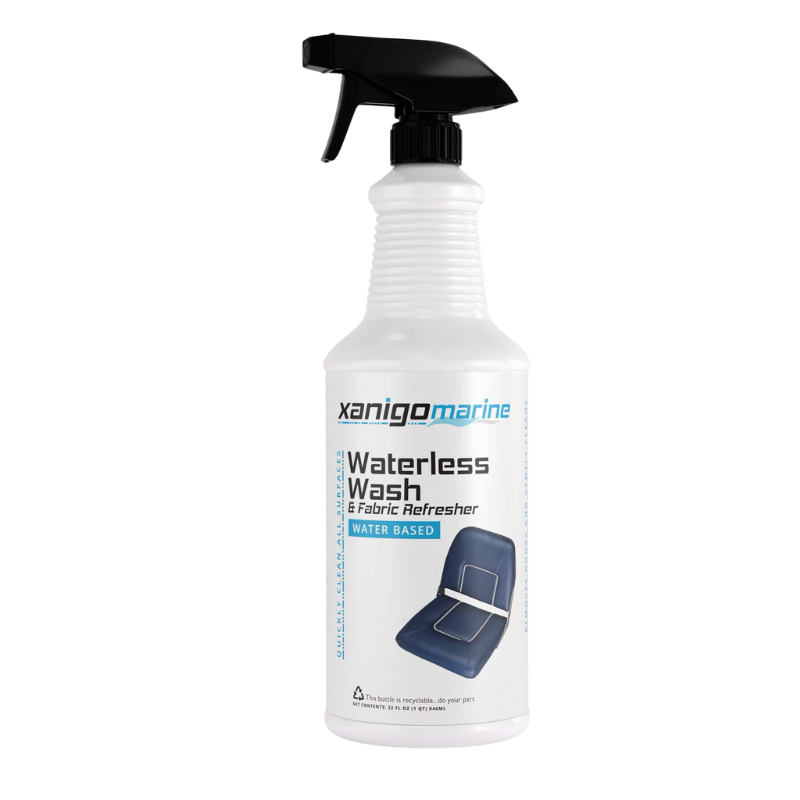 Xanigo Marine Waterless Wash & Fabric Refresher, a water-based cleaner and fabric refresher designed to clean surfaces quickly without the need for water. The bottle features a spray nozzle and an image of a clean fabric surface.