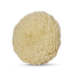 Soft, fluffy cream-colored wool polishing pad designed for finishing and buffing surfaces.