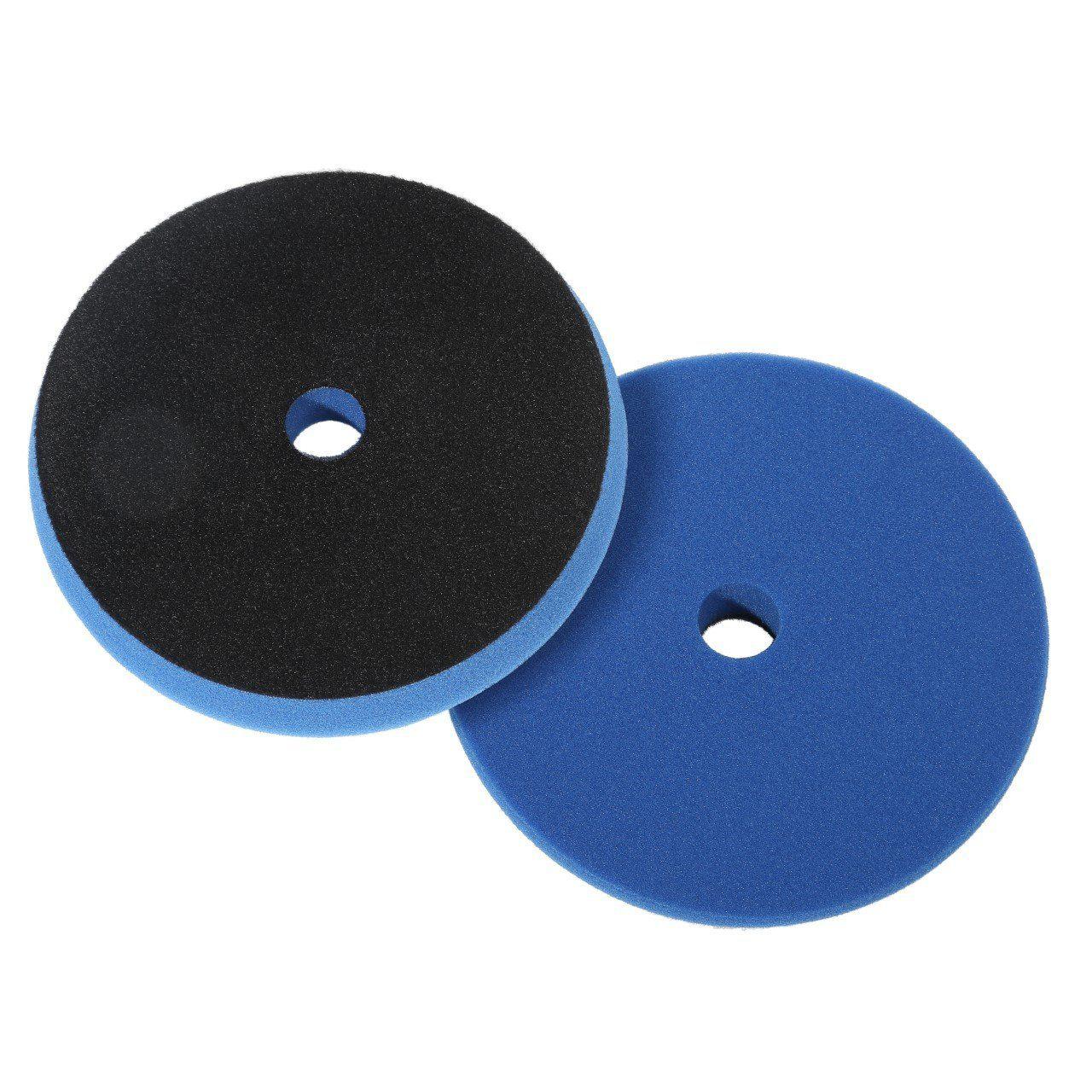 Two foam polishing pads with central holes, one black and the other blue, stacked side by side.