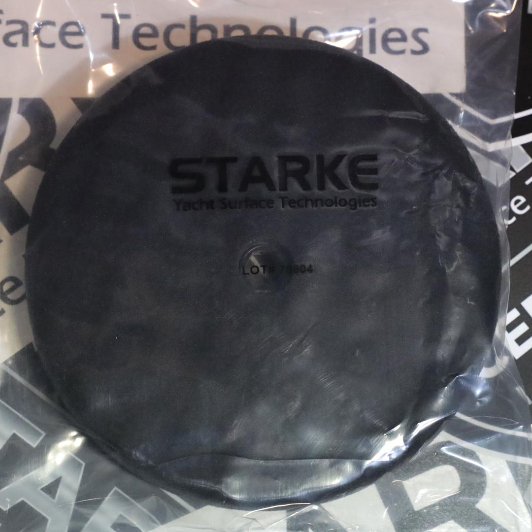 A Starke Double Sided Quick-Connect Black Foam Finishing Pad with a hexagonal hole in the center, designed for use with polishing machines.