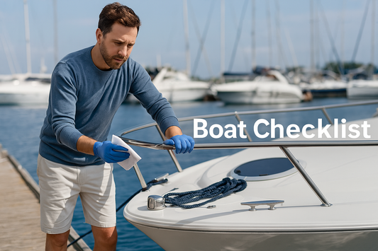 Man performing routine maintenance on a boat docked at a marina, inspecting and cleaning various surfaces in preparation for peak boating season.