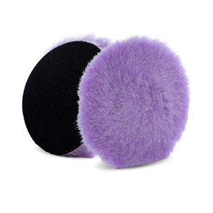 Two purple wool polishing pads with black backing, designed for use in polishing and cutting tasks, featuring soft, dense fibers for effective abrasion and finishing.