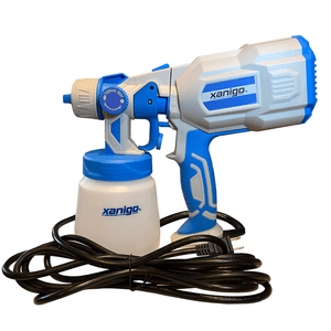 Close-up of a Xanigo Defender Atomizer spray gun with a bottle attached, placed with an electrical cord and plug visible.