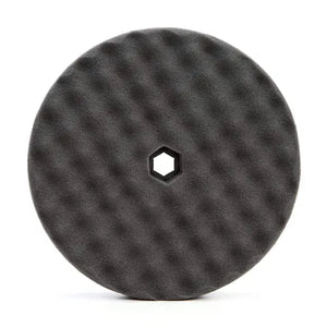 A Starke Double Sided Quick-Connect Black Foam Finishing Pad with a hexagonal hole in the center, designed for use with polishing machines.