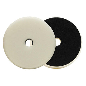 Two polishing pads, one with a white surface and the other with a black surface, both featuring a central hole for attachment.